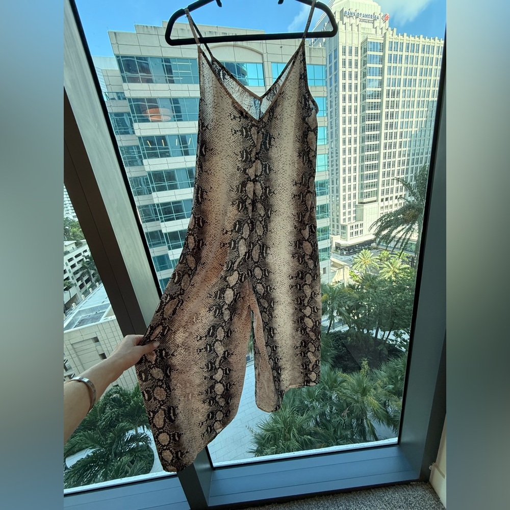 Snakeskin jumpsuit with pockets, brand new